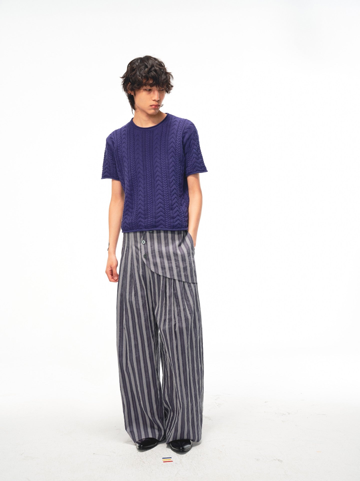 JCAESAR Armored‑style striped trousers with curved side panels