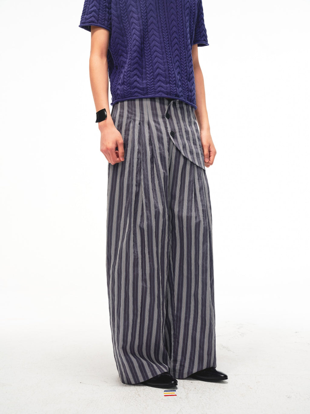 JCAESAR Armored‑style striped trousers with curved side panels