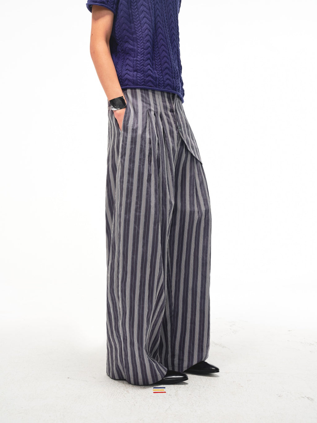 JCAESAR Armored‑style striped trousers with curved side panels