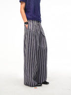 JCAESAR Armored‑style striped trousers with curved side panels