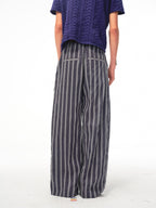 JCAESAR Armored‑style striped trousers with curved side panels