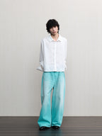 JCAESAR  Mint‑green washed denim jeans