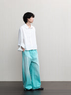 JCAESAR  Mint‑green washed denim jeans