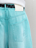 JCAESAR  Mint‑green washed denim jeans