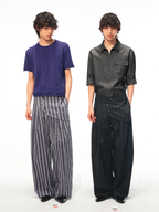 JCAESAR Armored‑style striped trousers with curved side panels