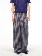JCAESAR Armored‑style striped trousers with curved side panels