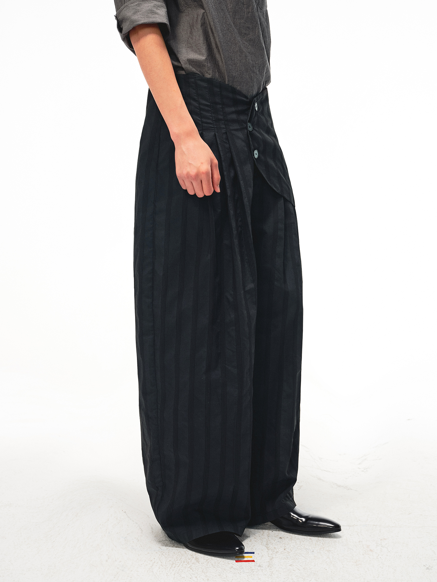JCAESAR Armored‑style striped trousers with curved side panels